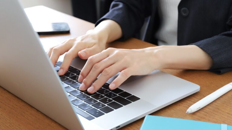 person investigating on laptop