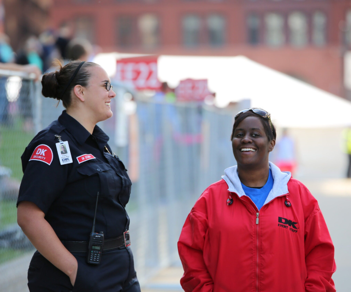 Two female security officers chatting.