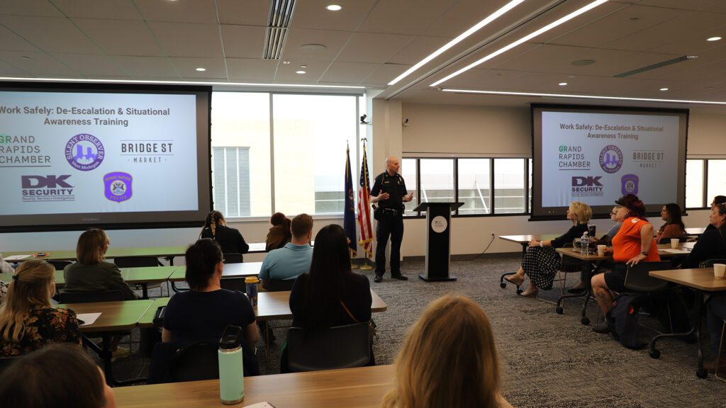 Grand Rapids Police Department chief Eric Winstrom provides a departmental update to an audience of safety training participants
