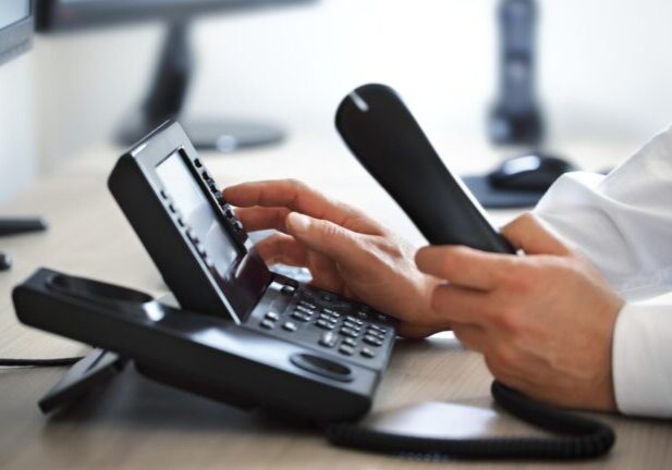 a command call center operator making a phone call