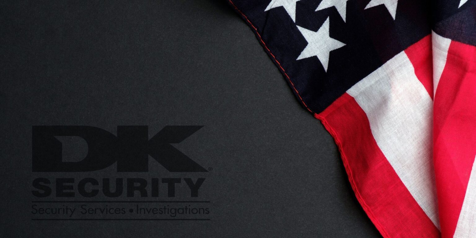 Semi-transparent DK Security logo placed on a dark background. A USA flag lies on the right side of the dark background.